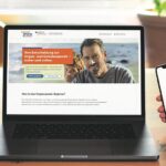 Zu sehen ist ein Laptop, der www.organspende-register.de zeigt, und daneben eine rechte Hand mit einem Smartphone, auf dem die AusweisApp geöffnet ist.